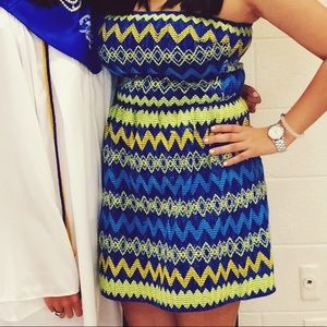 Blue dress with yellow and green stitching